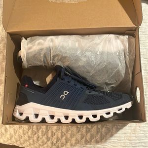 Mens on cloud shows size 10. Never worn. Only taken out of the box to take photo
